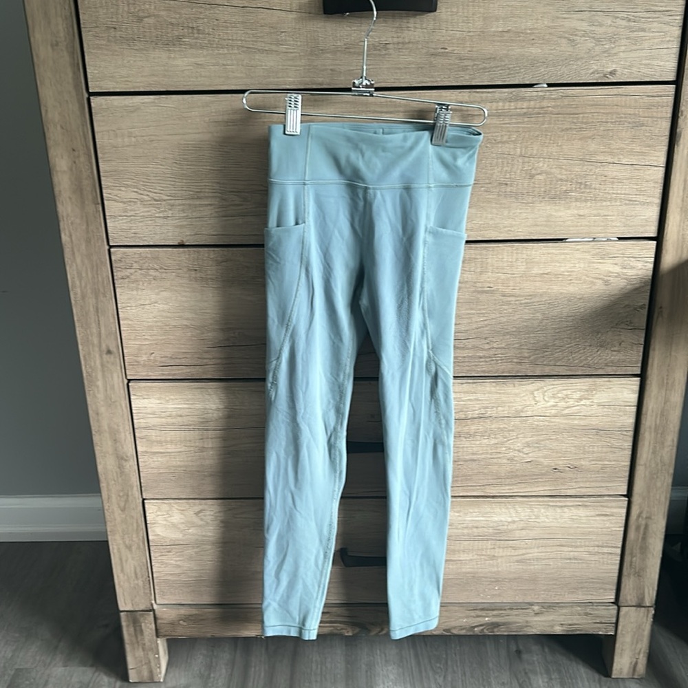 Athleta “stash your treasures tight” soft teal leggings , girls medium size 8/10
